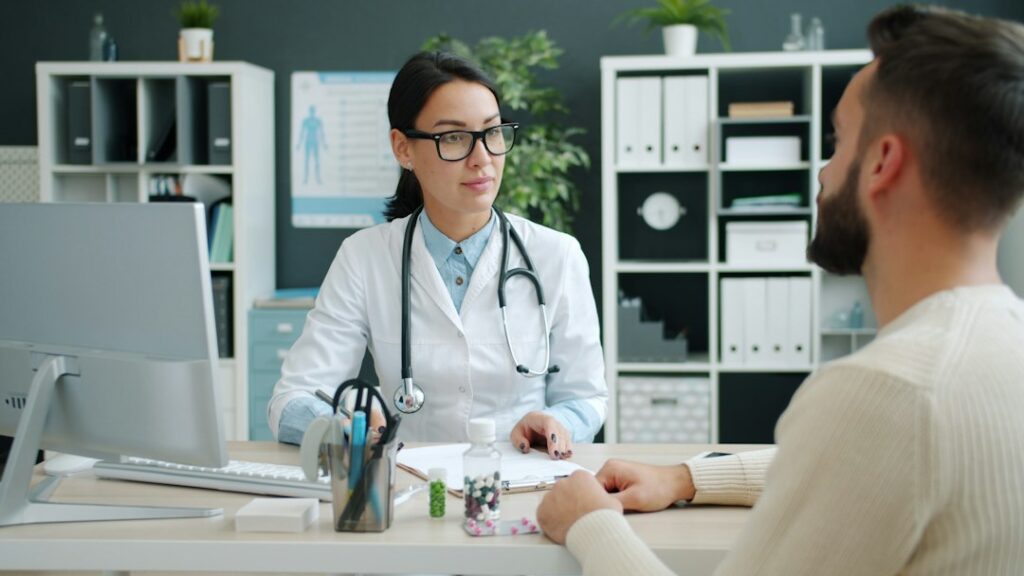 GP consultation with a woman discussing apron belly health risks and red flags